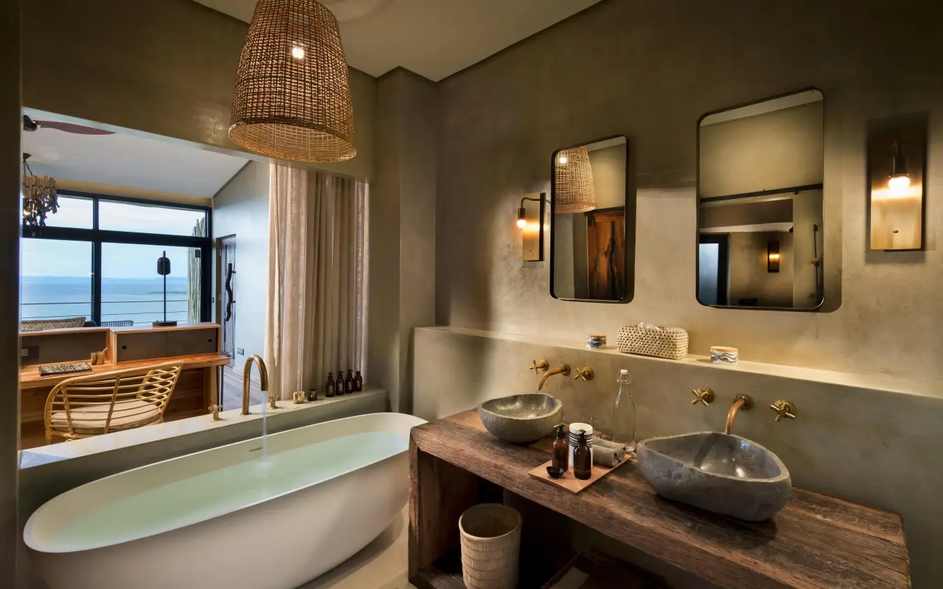 Luxury bathroom with dual vessel sinks and soaking tub, Bumi Hills Safari Lodge, Matusadona National Park, Zimbabwe
