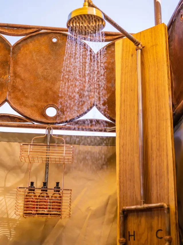 Shower interior with woven textile and wooden frame details, Camp Doros, Damaraland, Namibia