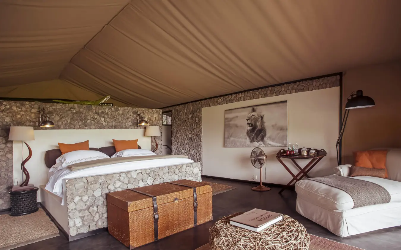 Luxurious safari tent bedroom with canvas ceiling and furnishings, Chem Chem Lodge, Lake Manyara, Tanzania