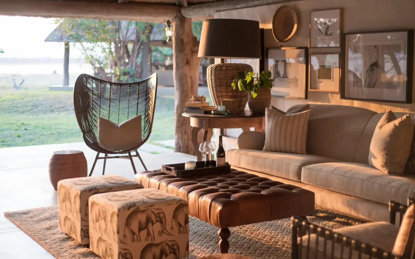 Open-air lounge with seating overlooking waterfront landscape, Chikwenya Camp, Mana Pools, Zimbabwe