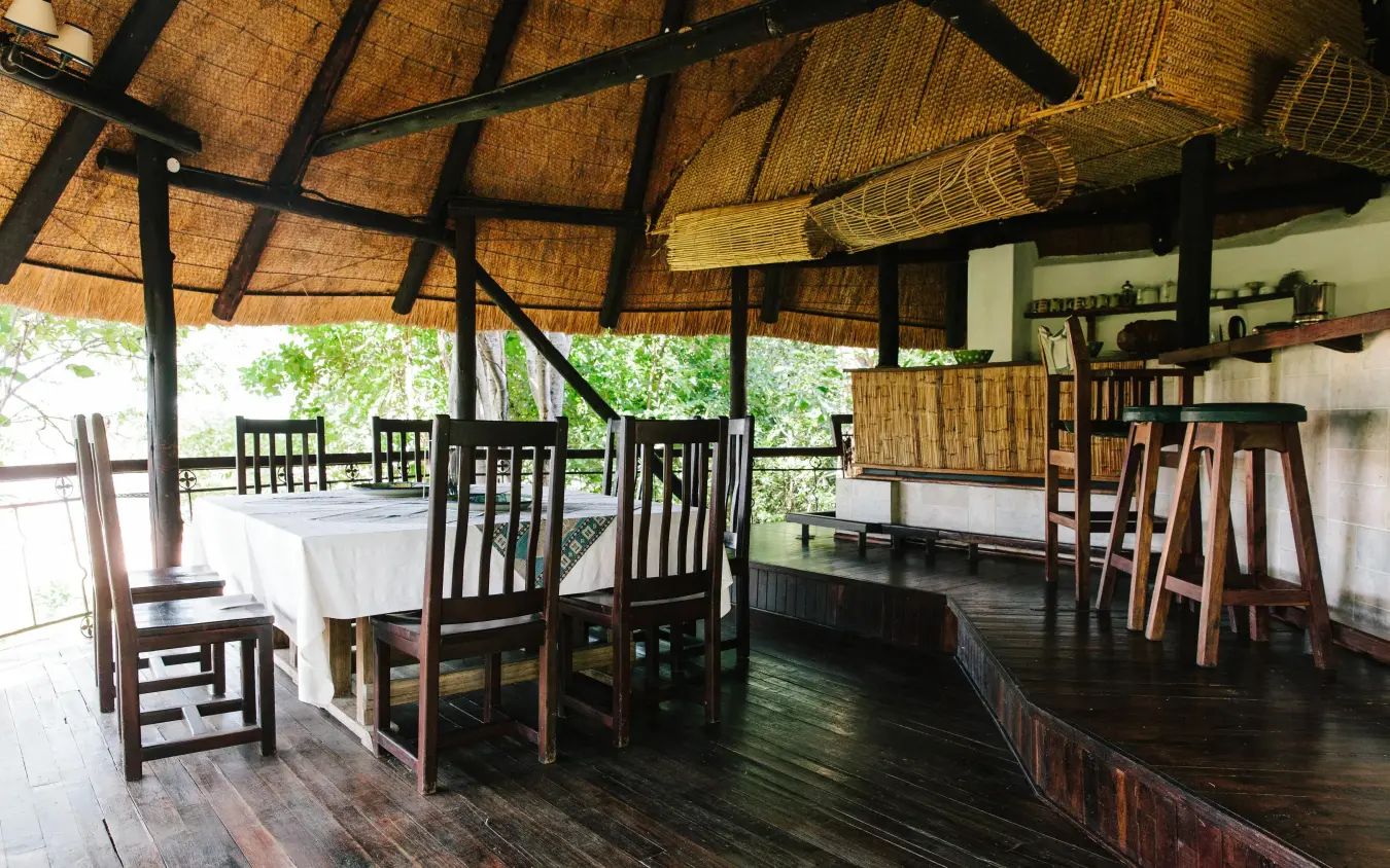 Open-air dining pavilion with thatched roof and wooden furniture, Chilo Gorge Safari Lodge, Gonarezhou & Malilangwe, Zimbabwe