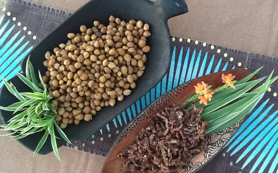 Overhead view of cooked chickpeas and dried meat on decorative platters, Chilo Gorge Safari Lodge, Gonarezhou & Malilangwe, Zimbabwe