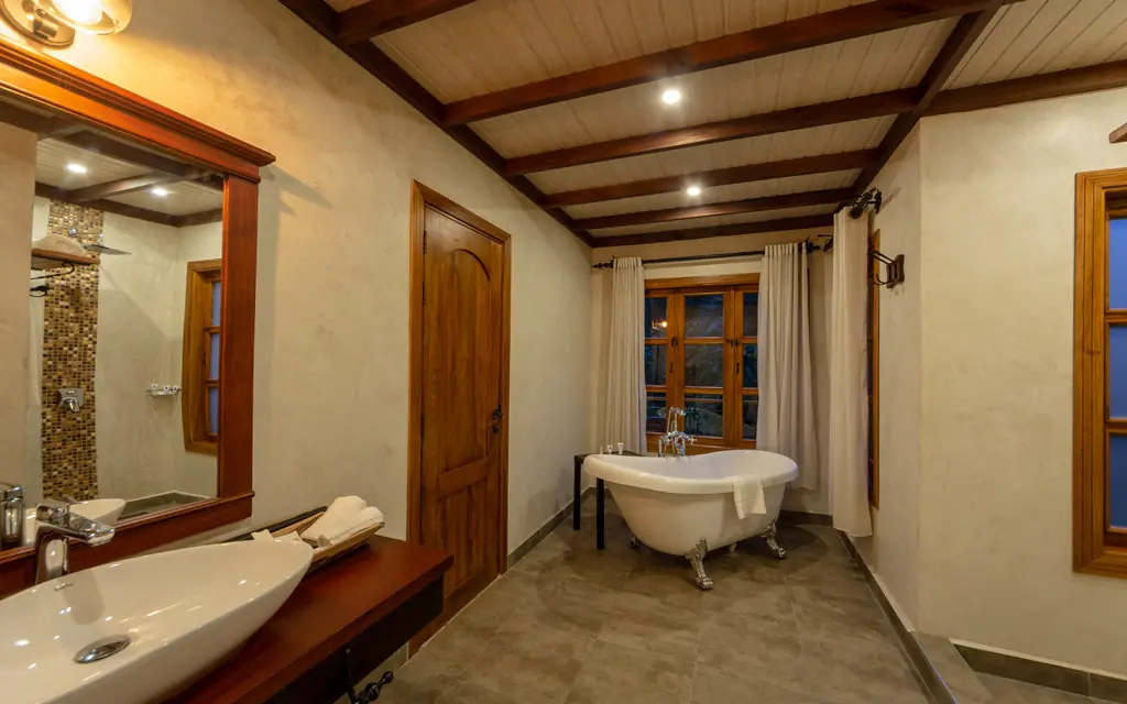 Luxury bathroom with freestanding tub and dual vanities, Chimpundu Lodge, Kibale Forest, Uganda