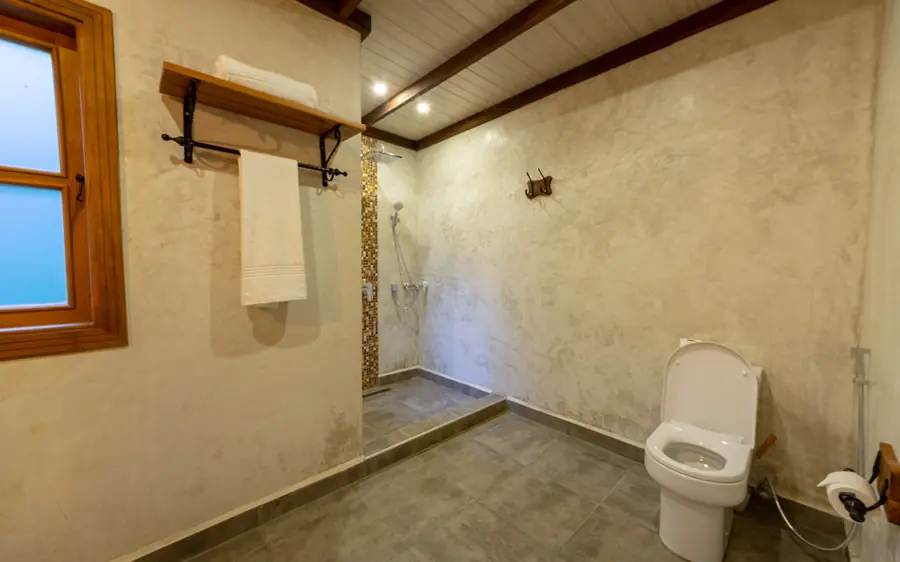 Open-air bathroom with toilet and rainfall shower area, Chimpundu Lodge, Kibale Forest, Uganda