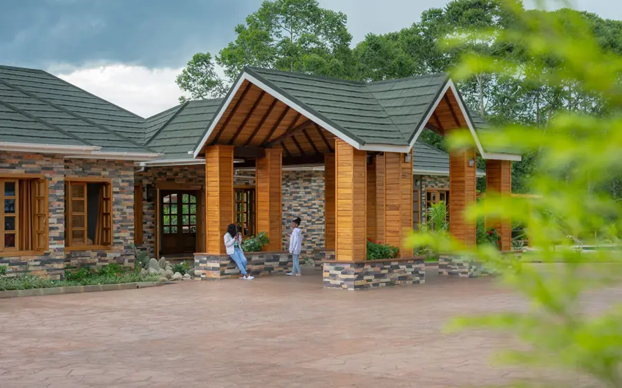 Modern lodge building with stone and wood exterior design, Chimpundu Lodge, Kibale Forest, Uganda