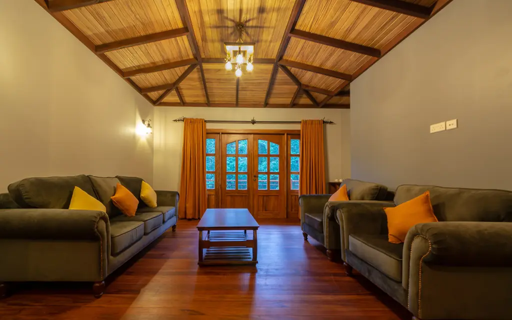 spacious lounge with wooden ceiling and comfortable seating, Chimpundu Lodge, Kibale Forest, Uganda