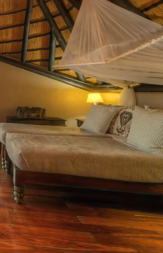 Bedroom suite with river views at sunset, Chobe Savanna Lodge, Zambezi Region, Namibia