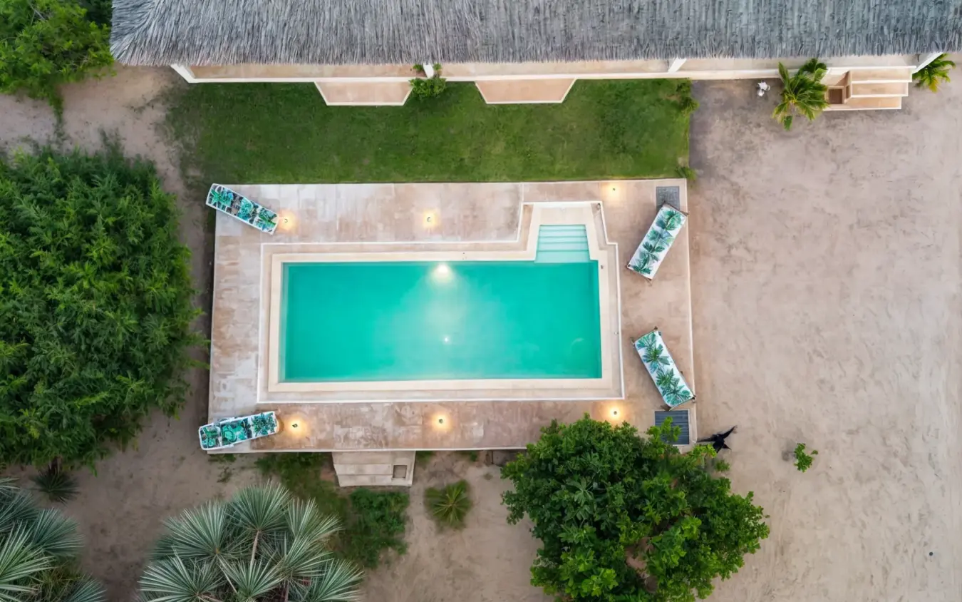 Rectangular swimming pool with loungers viewed from above, Chuchungi House, Lamu Archipelago, Kenya