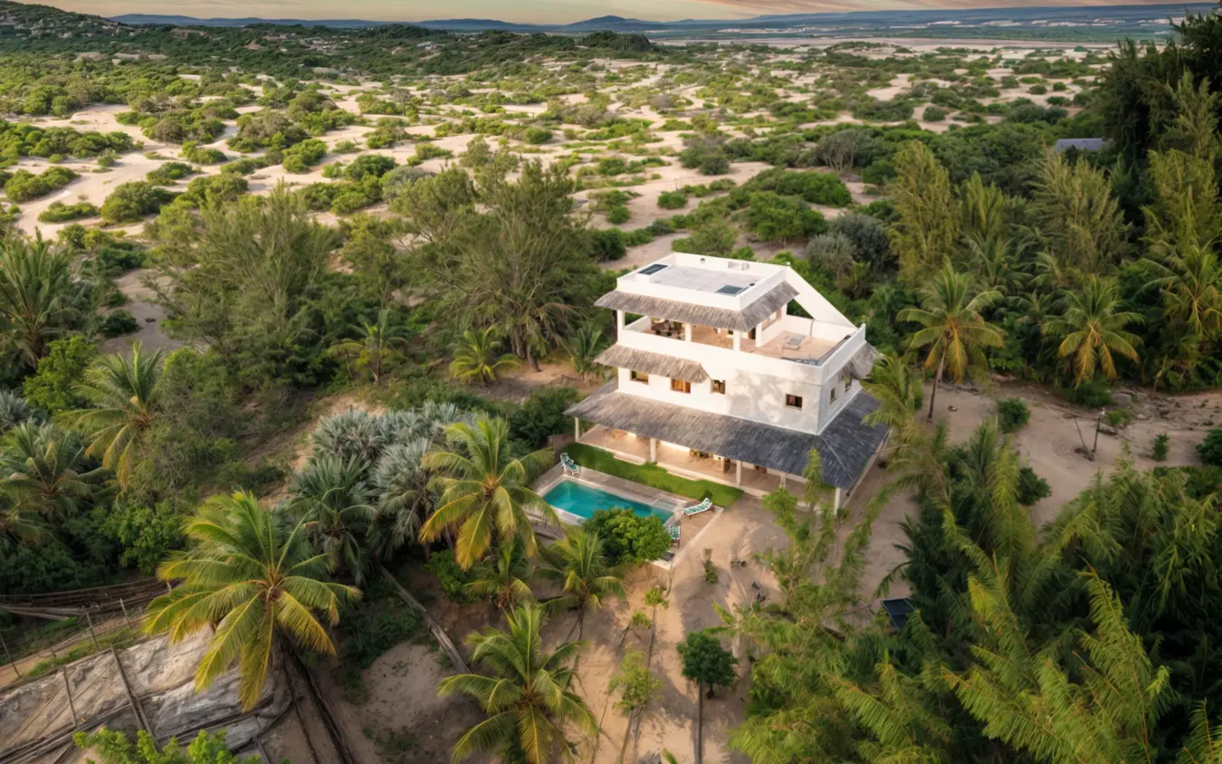 Modern white house with pool surrounded by palms and trees, Chuchungi House, Lamu Archipelago, Kenya