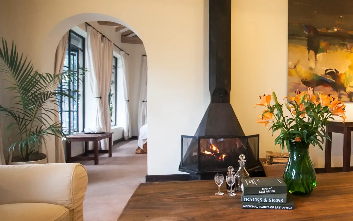 Modern lodge interior with fireplace and mountain views, Clouds Mountain Gorilla Lodge, Bwindi Impenetrable Forest, Uganda