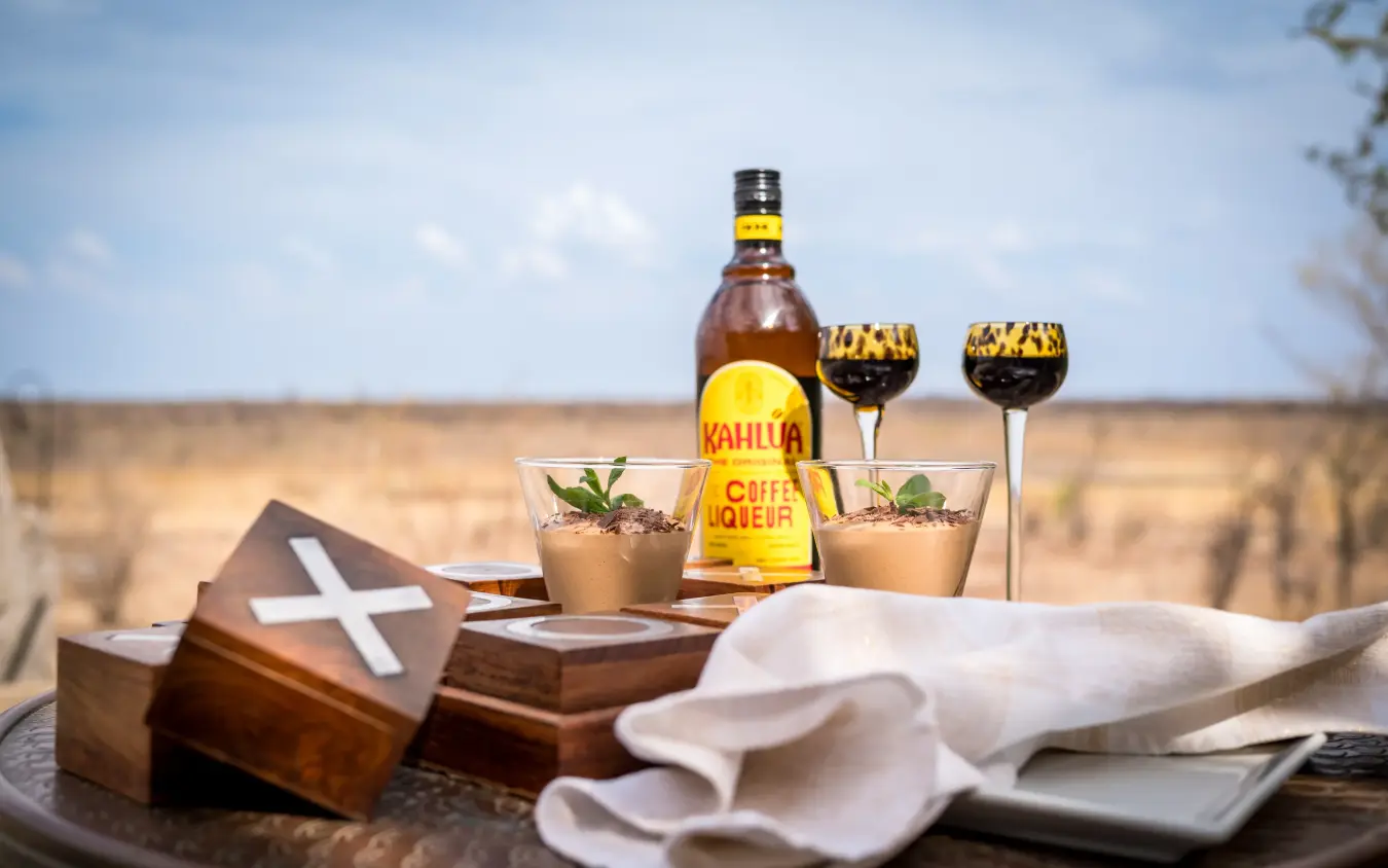 Kahlúa coffee liqueur served with cocktails overlooking arid savanna landscape, Daka Plains Camp, Hwange National Park, Zimbabwe