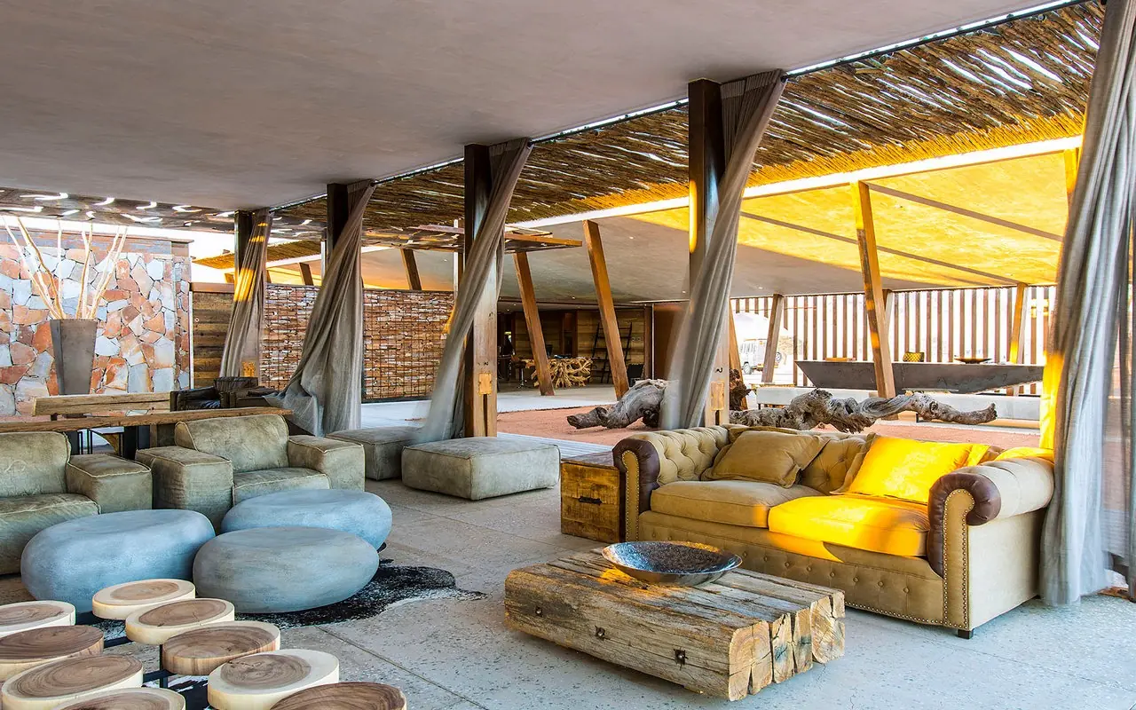 Open-air lounge with seating areas and natural lighting, Dead Valley Lodge, Sossusvlei, Namibia