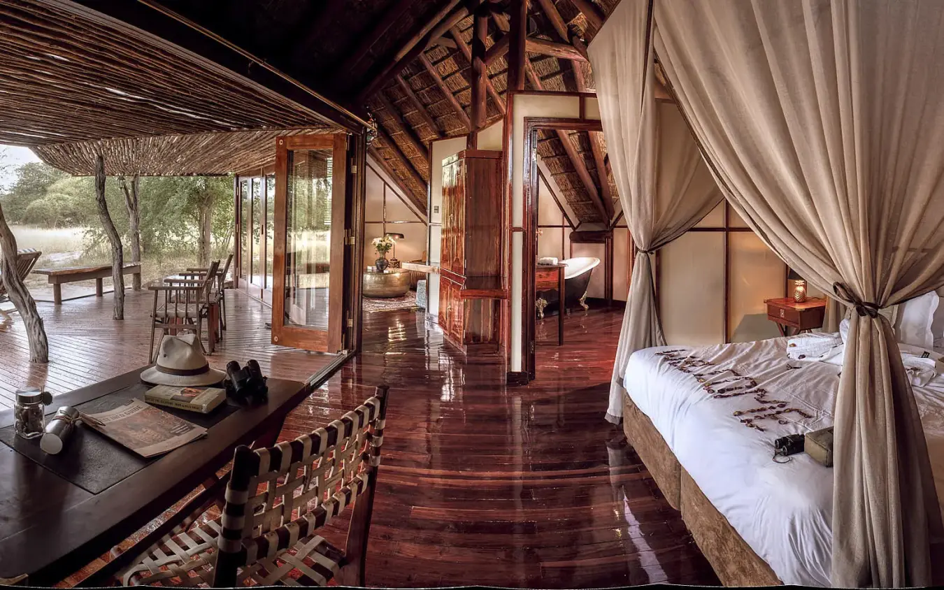 Luxury safari suite with canopy bed and river views, Deception Valley Lodge, Central Kalahari, Botswana