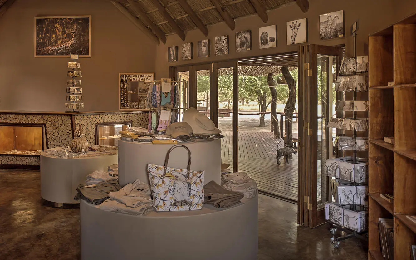 Indoor lounge with display cases and artwork on walls, Deception Valley Lodge, Central Kalahari, Botswana