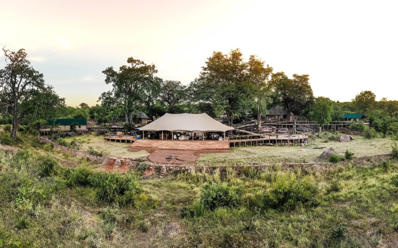 Large canvas tent lodge with wooden decking in bushland clearing, Deteema Springs Camp, Hwange National Park, Zimbabwe