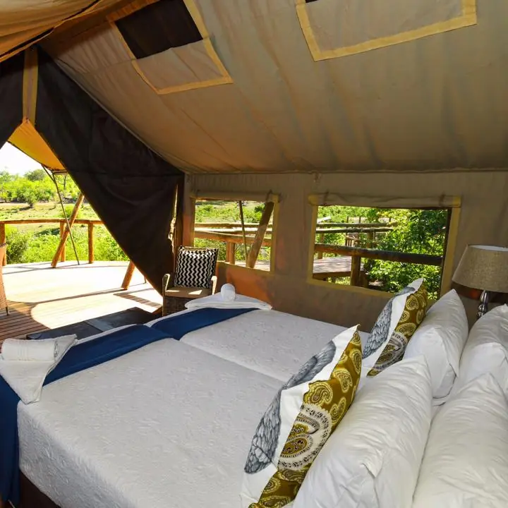 Luxury safari tent bedroom with open-air deck and valley views, Deteema Springs Camp, Hwange National Park, Zimbabwe