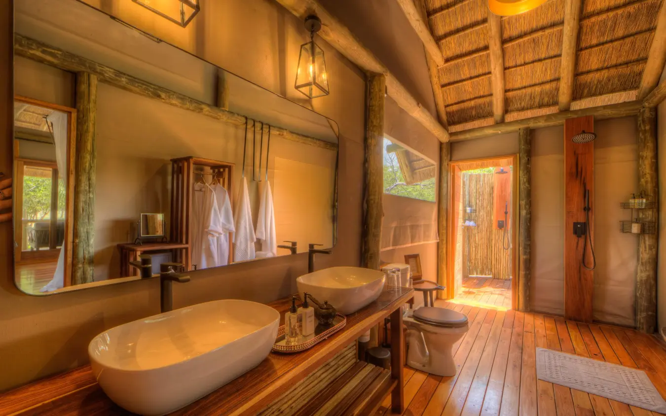 Luxury bathroom with freestanding bathtub and dual vanities, Dinaka, Central Kalahari, Botswana