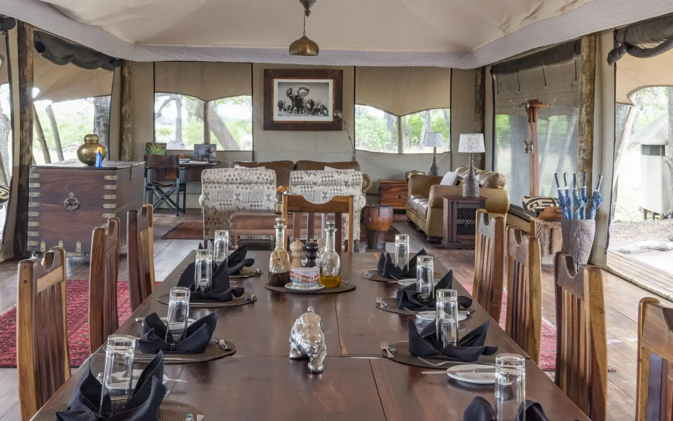 Elegant dining tent interior with long table setup, Duba Explorers Camp, The Okavango Delta, Botswana