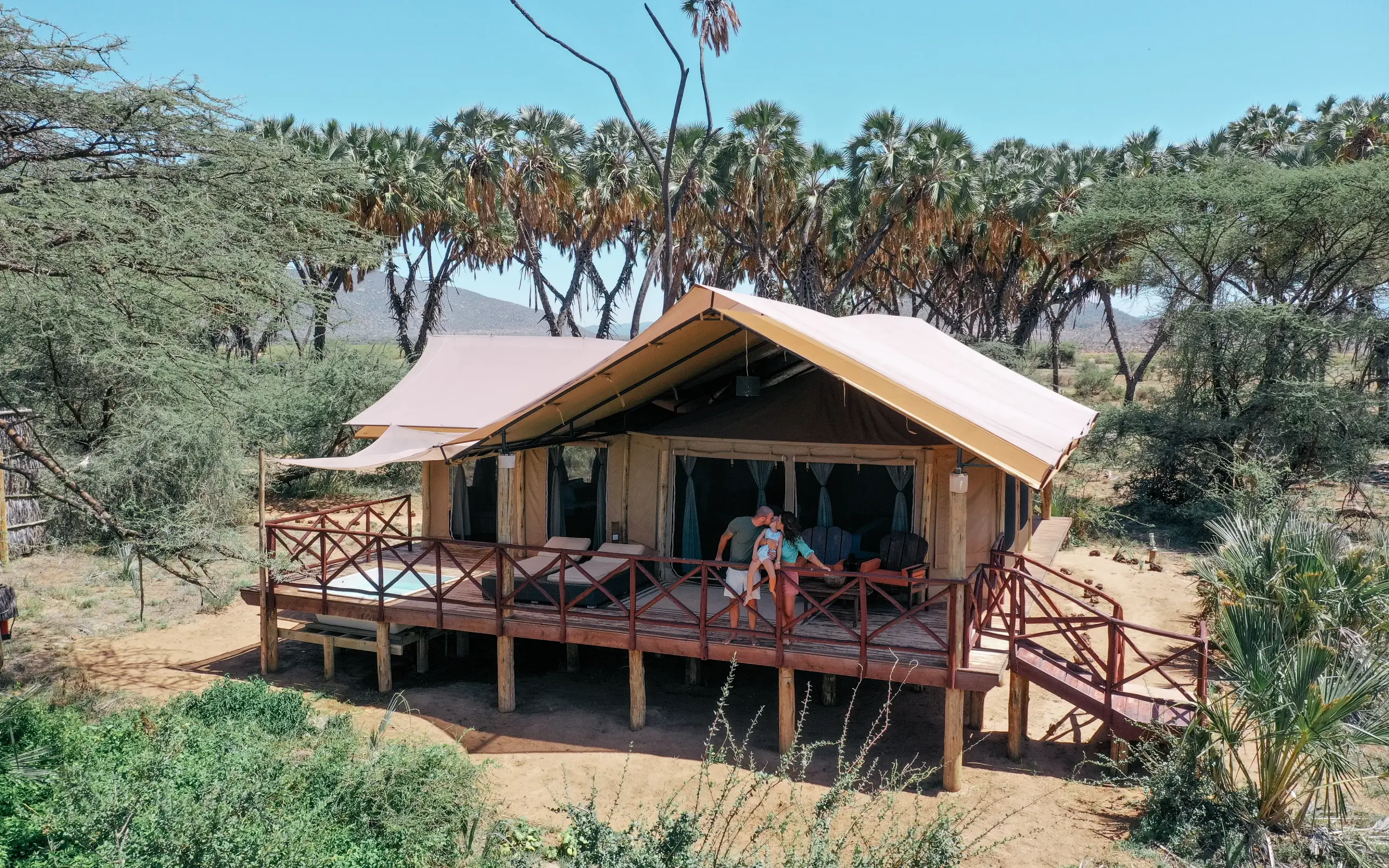 Raised safari tent with wooden deck overlooking acacia woodland camp, Elephant Bedroom Camp, Samburu Reserve, Kenya