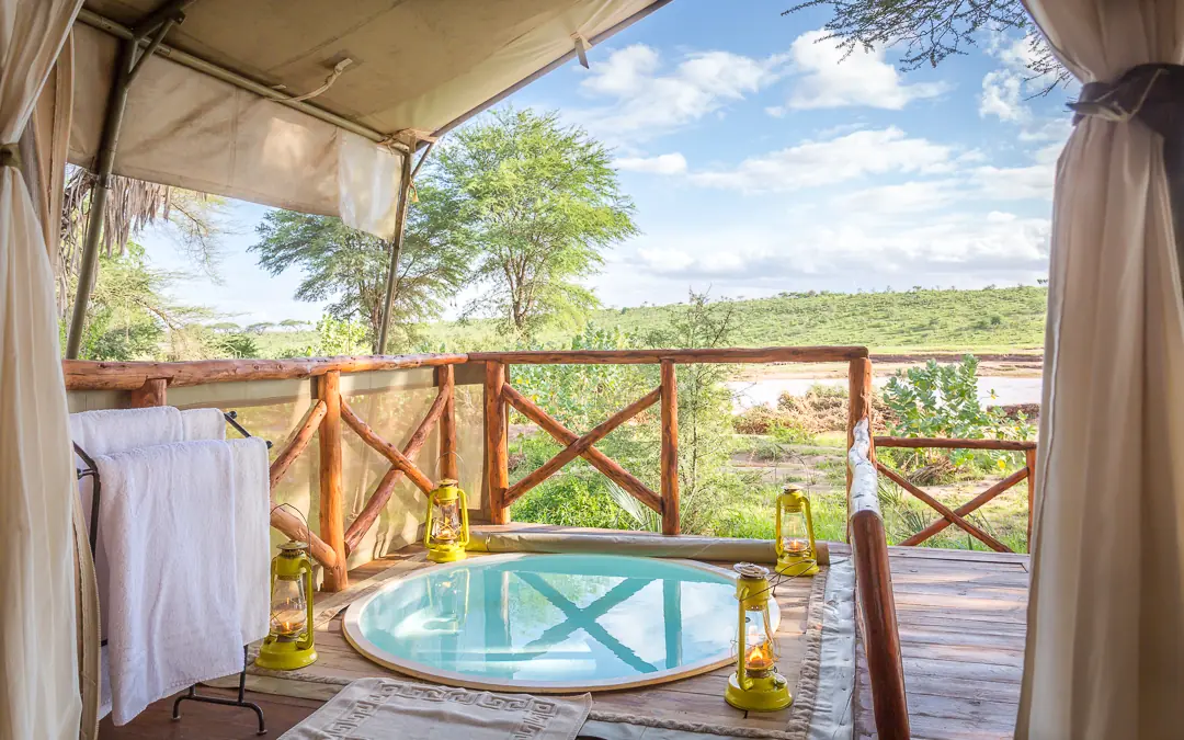 Outdoor bathtub on wooden deck overlooking savanna landscape, Elephant Bedroom Camp, Samburu Reserve, Kenya