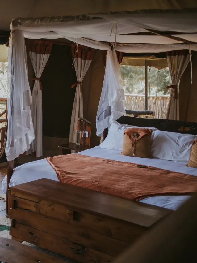 Spacious safari tent bedroom with open deck overlooking woodland landscape, Elephant Bedroom Camp, Samburu Reserve, Kenya