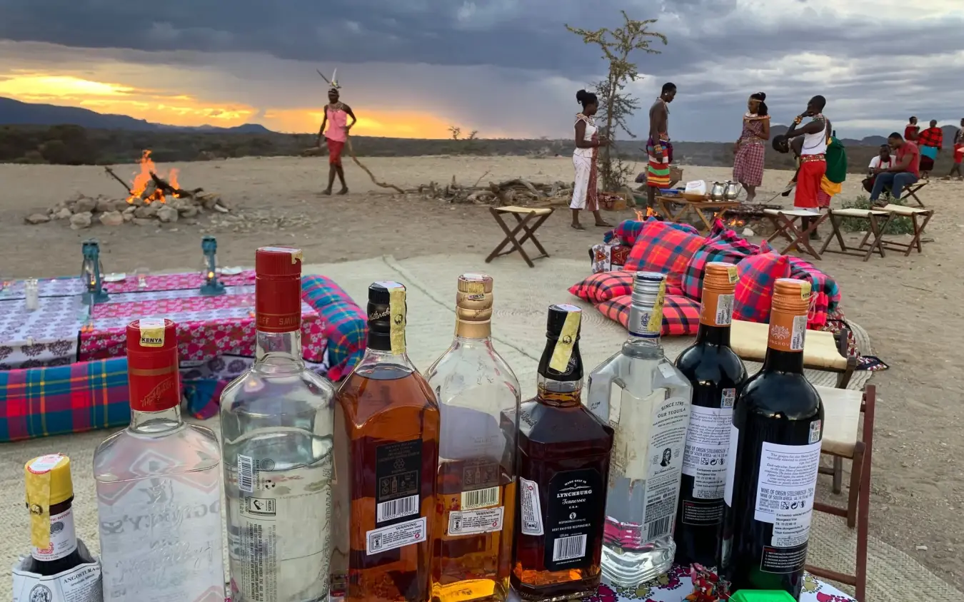Beach gathering at sunset with local community members, Elephant Watch Camp, Samburu Reserve, Kenya