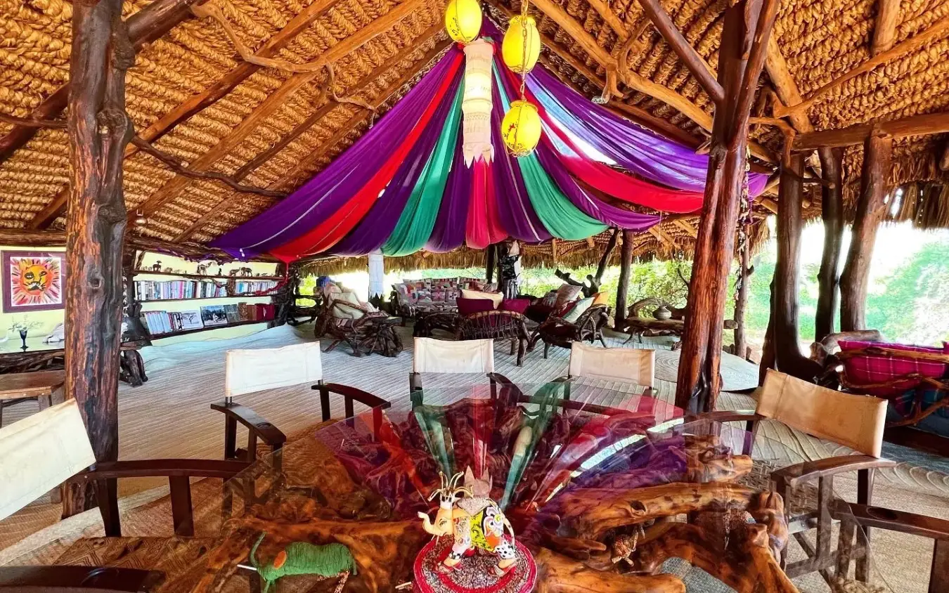 Colorful draped lounge area with wooden beams and decorative lanterns, Elephant Watch Camp, Samburu Reserve, Kenya