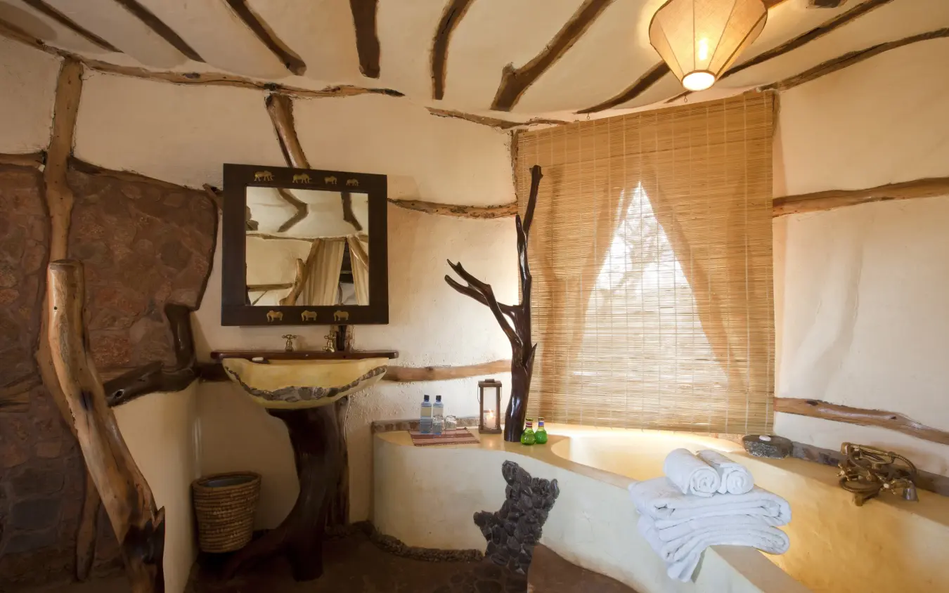 Rustic bathroom with wooden beams and natural materials, Elerai, Amboseli and Chyulu Hills, Kenya
