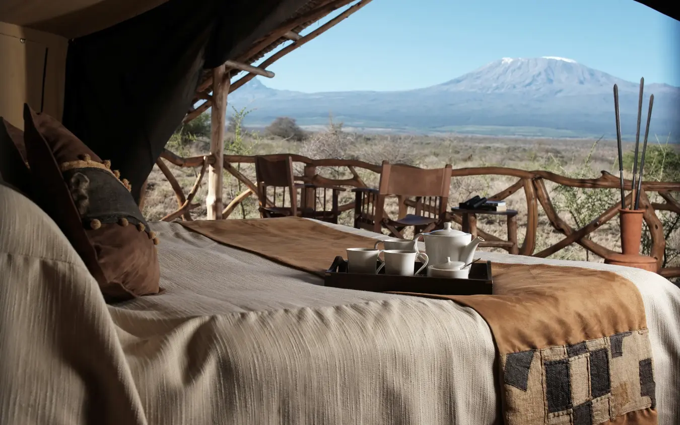 Bedroom deck overlooking volcanic mountain landscape, Elerai, Amboseli and Chyulu Hills, Kenya