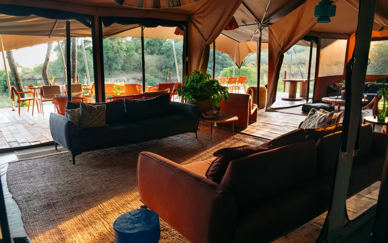 Open-air lounge tent with views across savanna landscape, Emboo Camp, Maasai Mara, Kenya