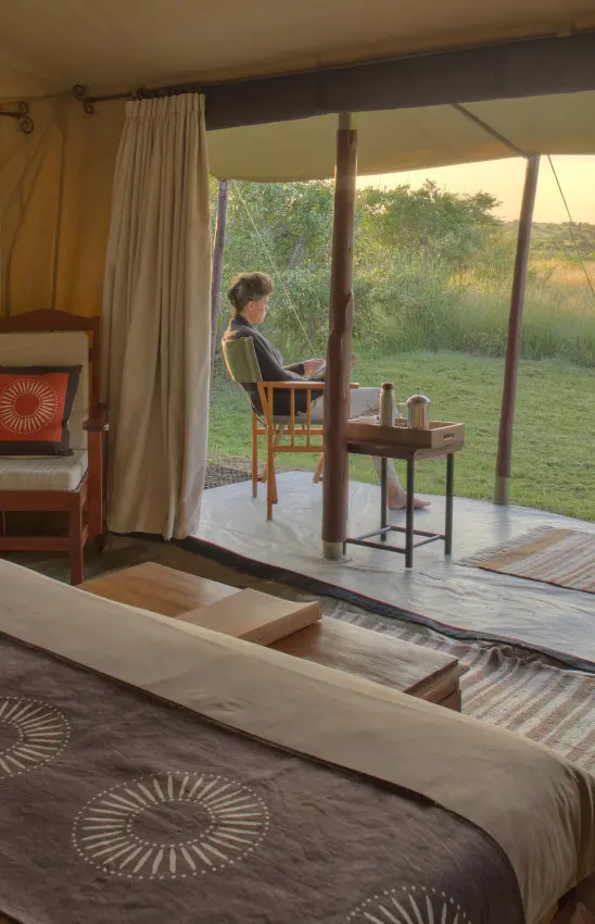 Safari bedroom with expansive views of African savanna landscape, Encounter Mara Camp, Maasai Mara, Kenya