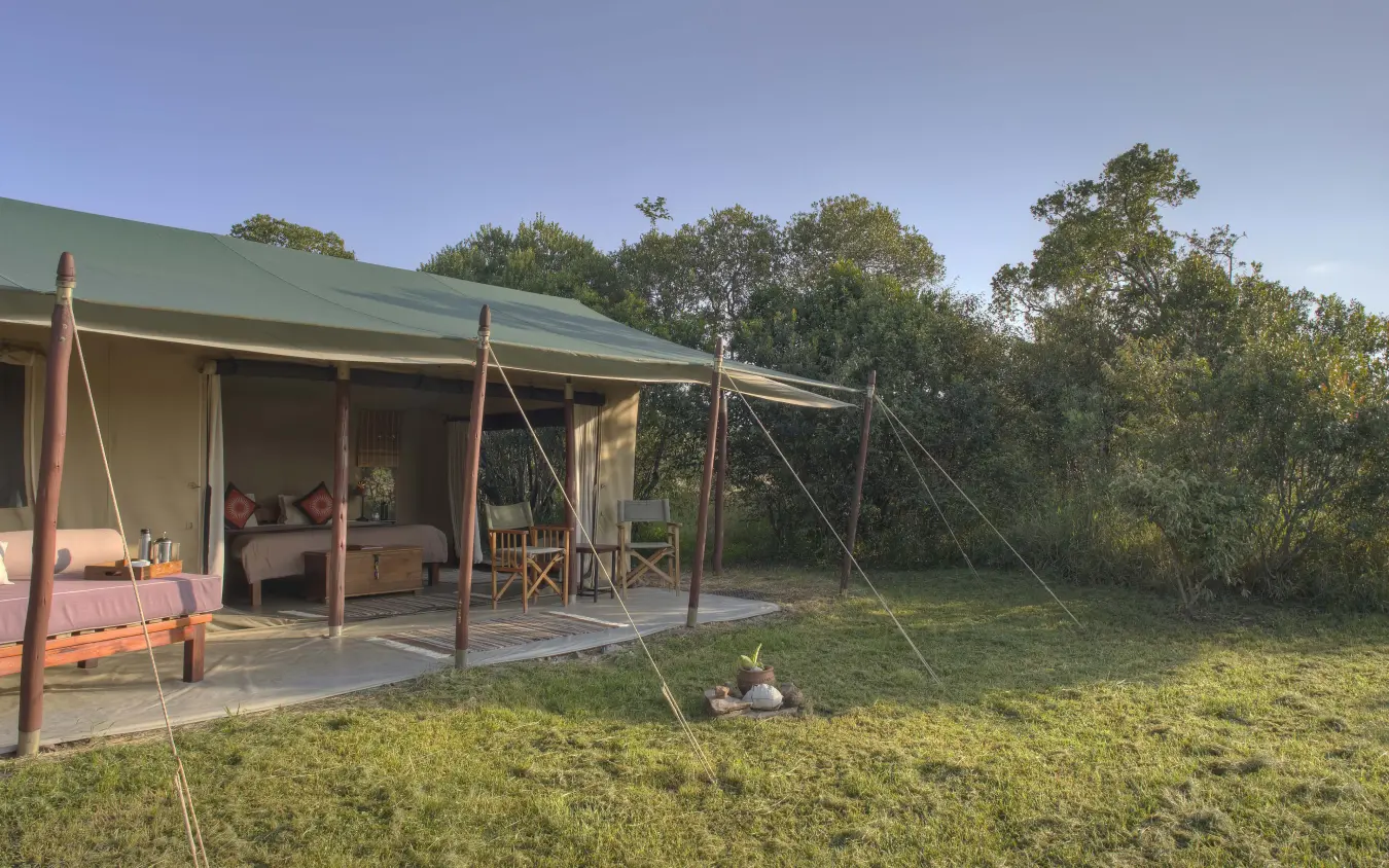 Safari tent accommodation with bed and viewing deck at dusk, Encounter Mara Camp, Maasai Mara, Kenya