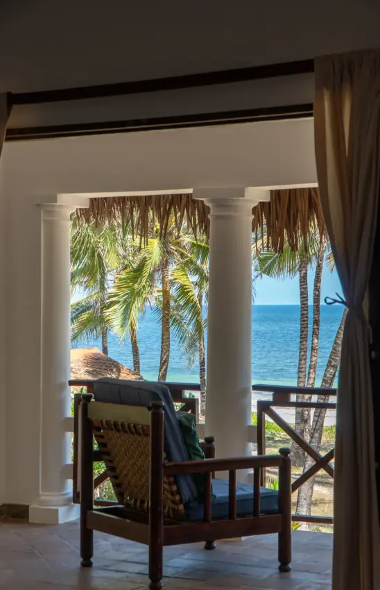Beachfront terrace with colonial columns and ocean view through palm trees, Enkare Bofa, Kilifi, Kenya