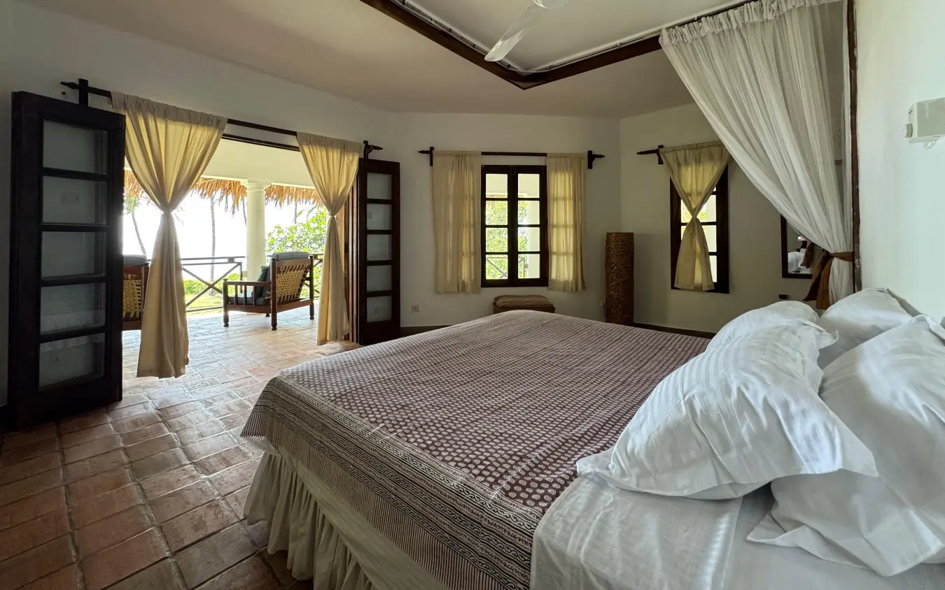 Spacious bedroom suite with multiple doors opening onto terraces overlooking landscape, Enkare Bofa, Kilifi, Kenya