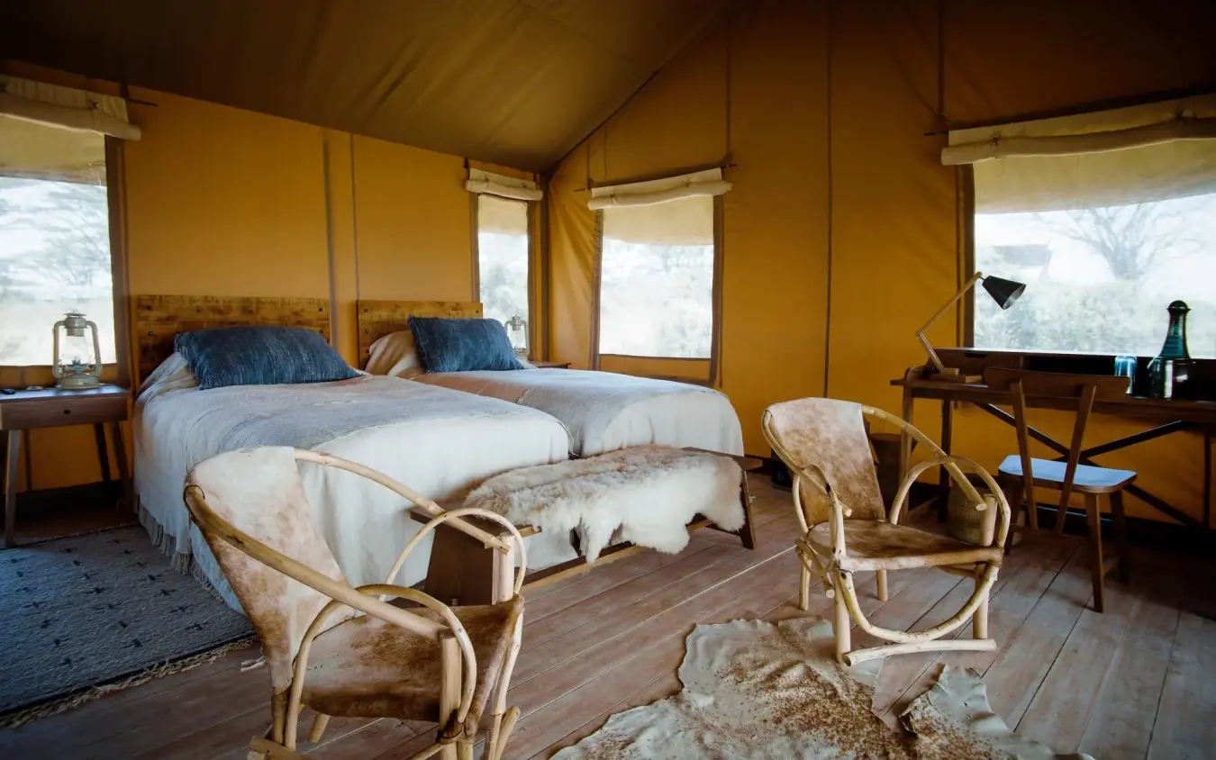 Luxury safari tent interior with canvas walls and panoramic windows overlooking landscape, Entamanu Camp, Ngorongoro Crater, Tanzania