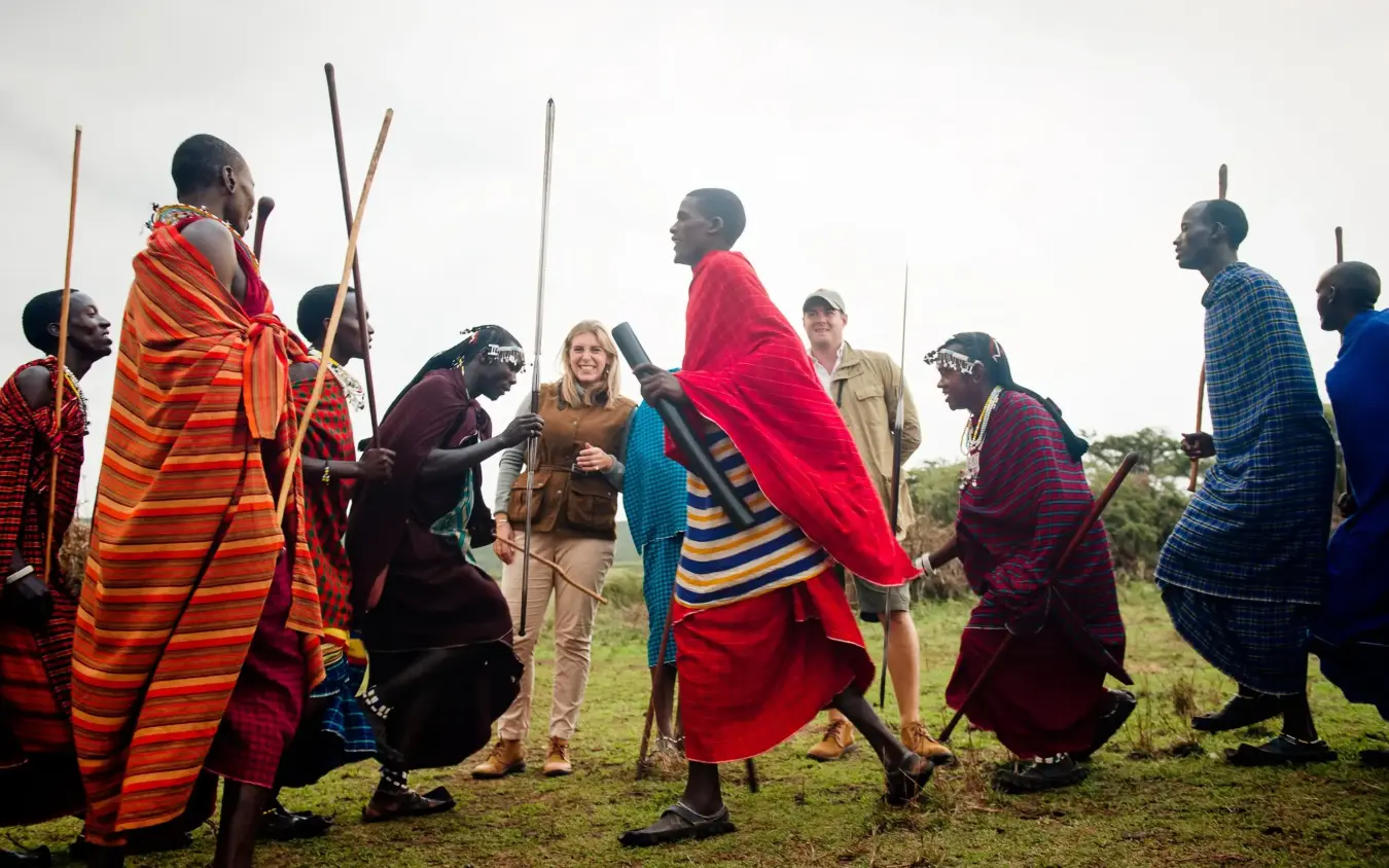 Maasai warriors greeting tourists in traditional clothing, Entamanu Camp, Ngorongoro Crater, Tanzania