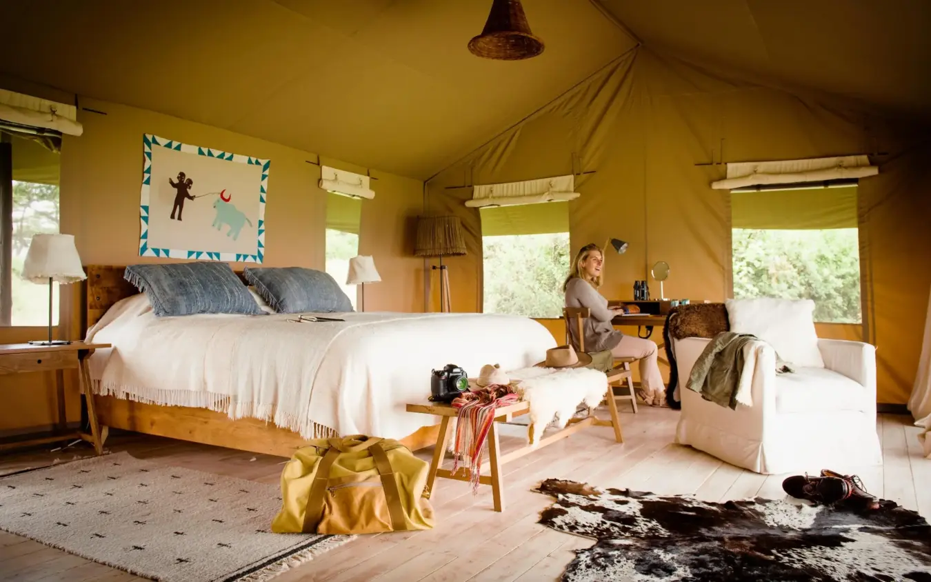 Spacious canvas safari tent bedroom with multiple beds, Entamanu Camp, Ngorongoro Crater, Tanzania