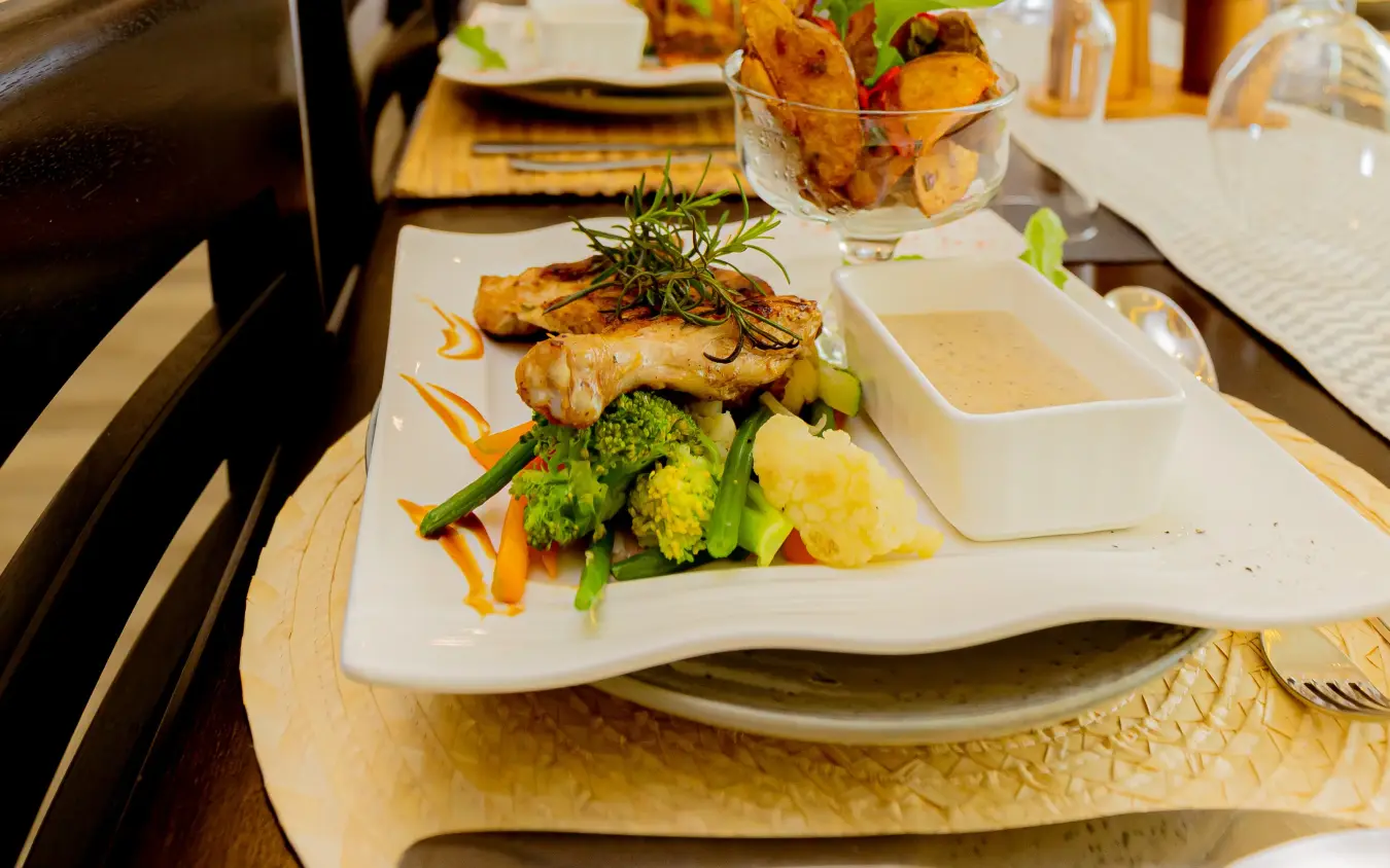 Plated appetizers and drinks arranged on dining table, Farmhouse Rwanda, Volcanoes National Park, Rwanda