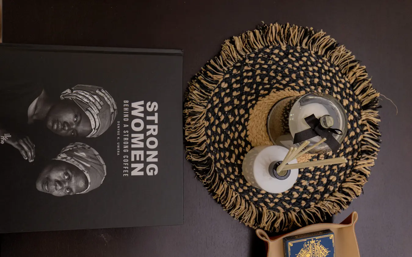 Decorative woven basket with ceramic vessels and book, Farmhouse Rwanda, Volcanoes National Park, Rwanda