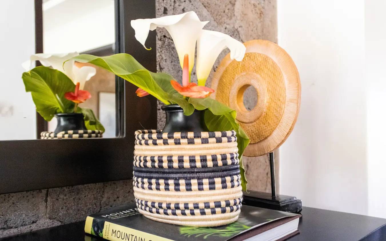 Decorative woven basket with white calla lilies and flowers, Farmhouse Rwanda, Volcanoes National Park, Rwanda