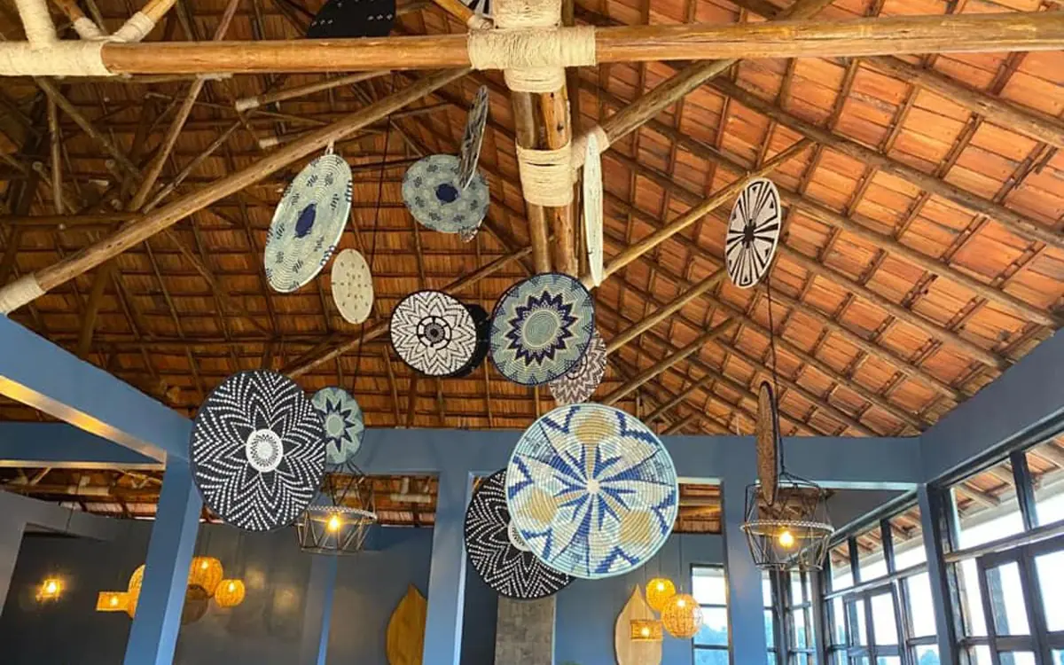 Interior ceiling with decorative woven plates and wooden beams, Five Volcanoes, Volcanoes National Park, Rwanda