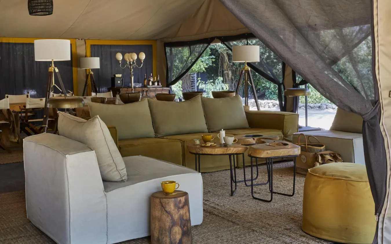 Luxury canvas tent lounge with cream and olive seating, Forest Chem Chem, Lake Manyara, Tanzania