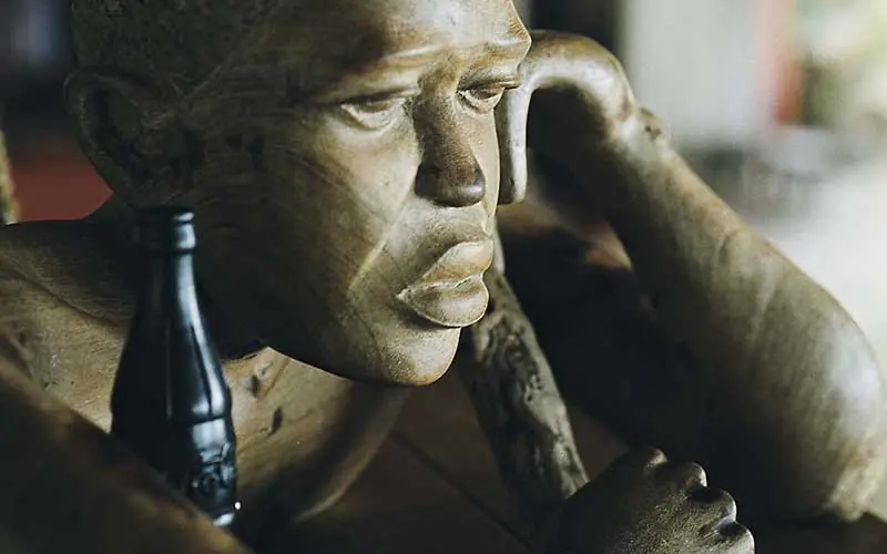 Bronze sculptural face detail with hand near cheek, Fundu Lagoon, Zanzibar & Pemba, Tanzania