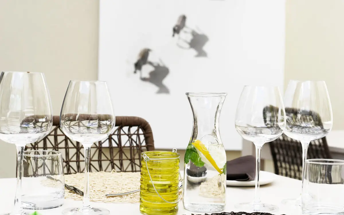 Table setting with wine glasses and fresh mint garnish, Galton House, Windhoek, Namibia