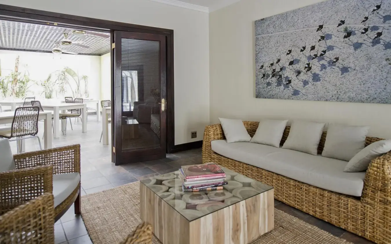 Contemporary lounge with woven furniture and ocean views, Galton House, Windhoek, Namibia