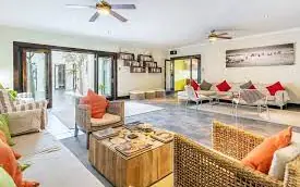 Open-plan lounge with seating areas and natural light, Galton House, Windhoek, Namibia