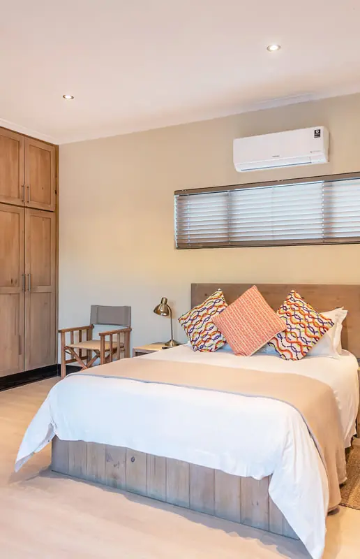 Spacious bedroom with dual beds and wooden wardrobe, Galton House, Windhoek, Namibia