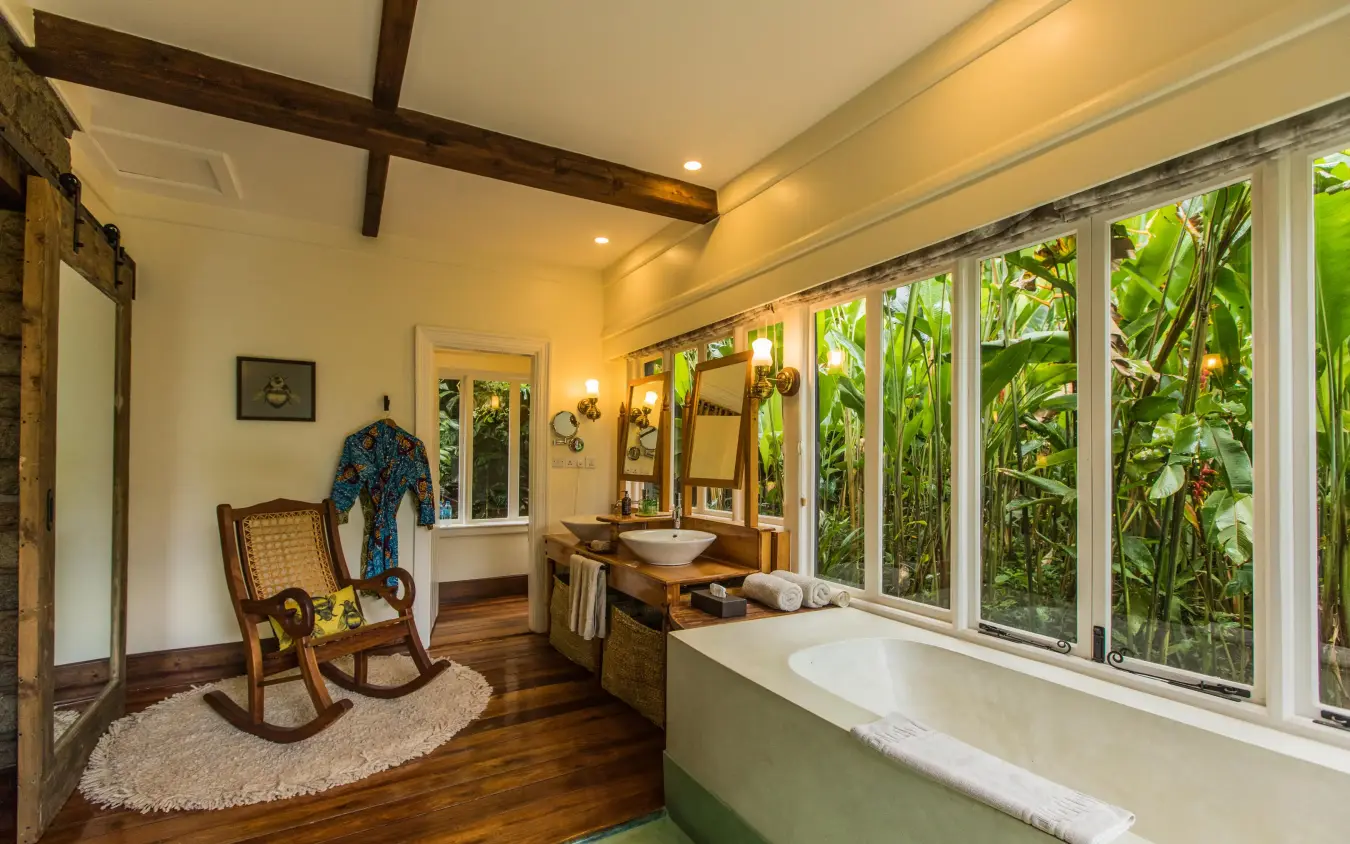 Luxury bathroom with soaking tub and garden views, Gibb’s Farm, Ngorongoro Crater, Tanzania