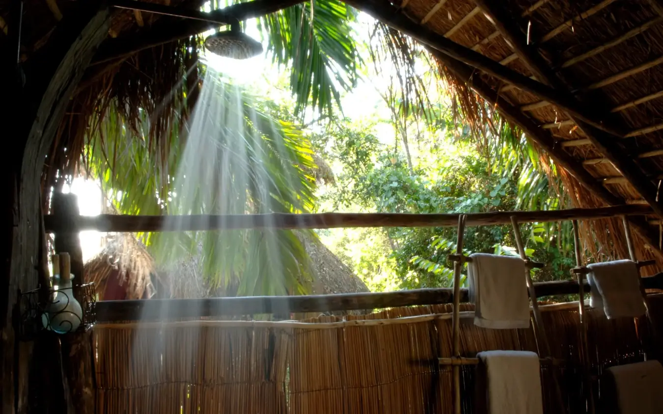 Outdoor shower structure with natural light and jungle views, Greystoke Mahale, Mahale Mountains, Tanzania