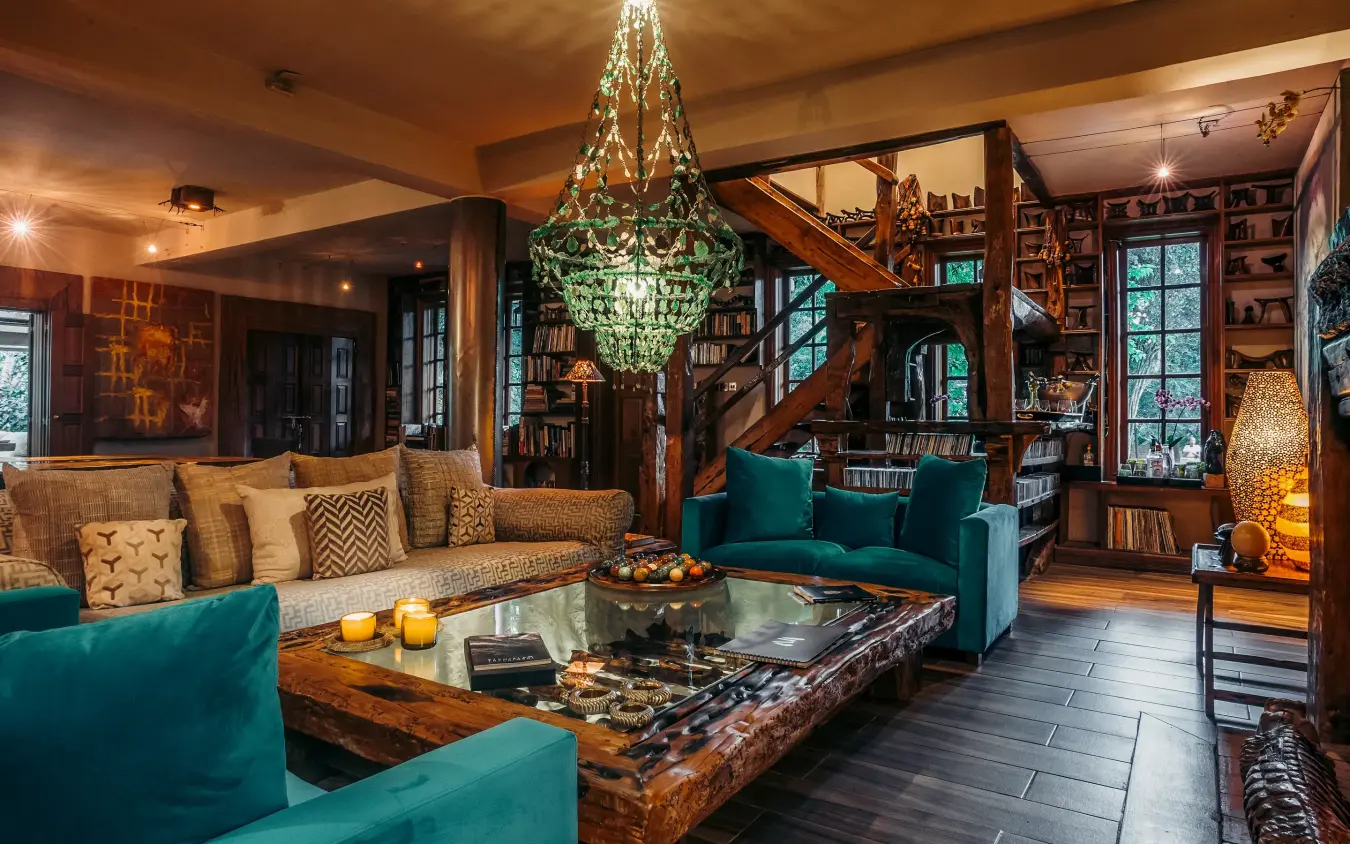 Luxurious lounge with teal seating and chandelier lighting, Hemingways Eden Residence, Nairobi, Kenya